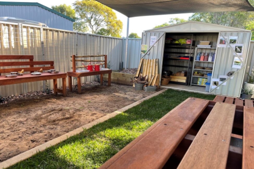 The completed outdoor space for Yumba Bimbi, featuring a shed, mud kitchen and water play stations