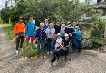 Volunteers cleaning flood-impacted properties in Logan